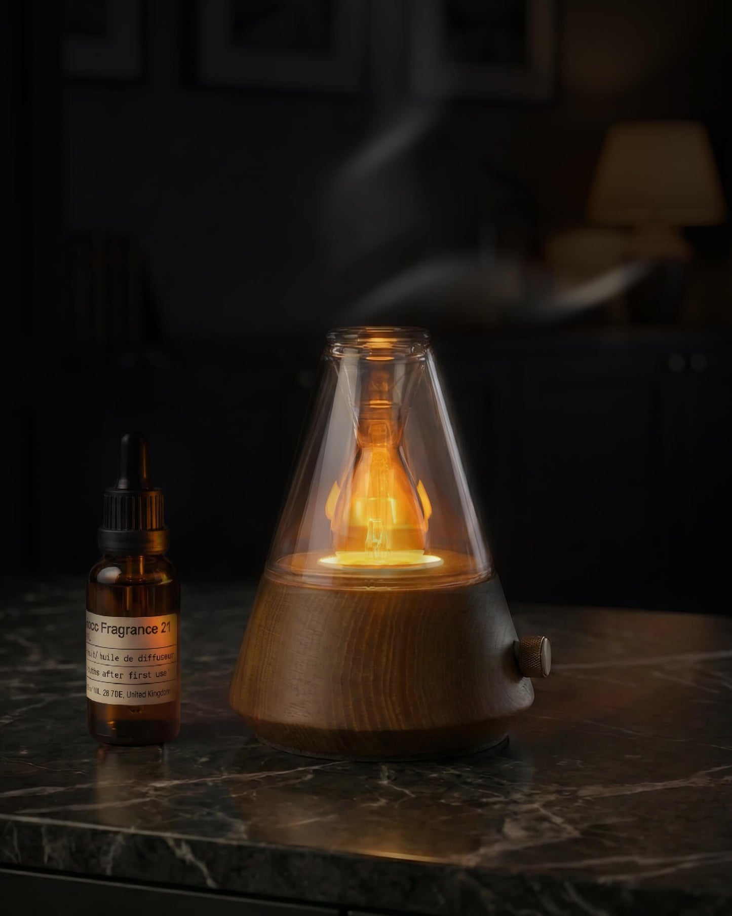 Chavanc Aroma conical waterless nebulizing diffuser with solid timber base and cone-shaped glass housing a warm glowing ambient lamp, emitting dry mist on a marble table.
