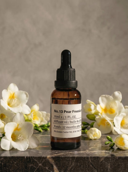Chavanc Aroma_ No. 13 English Pear & Freesia Whisper essential oil in the iconic amber glass apothecary bottle.