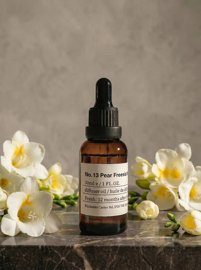 Chavanc Aroma_ No. 13 English Pear & Freesia Whisper essential oil in the iconic amber glass apothecary bottle.