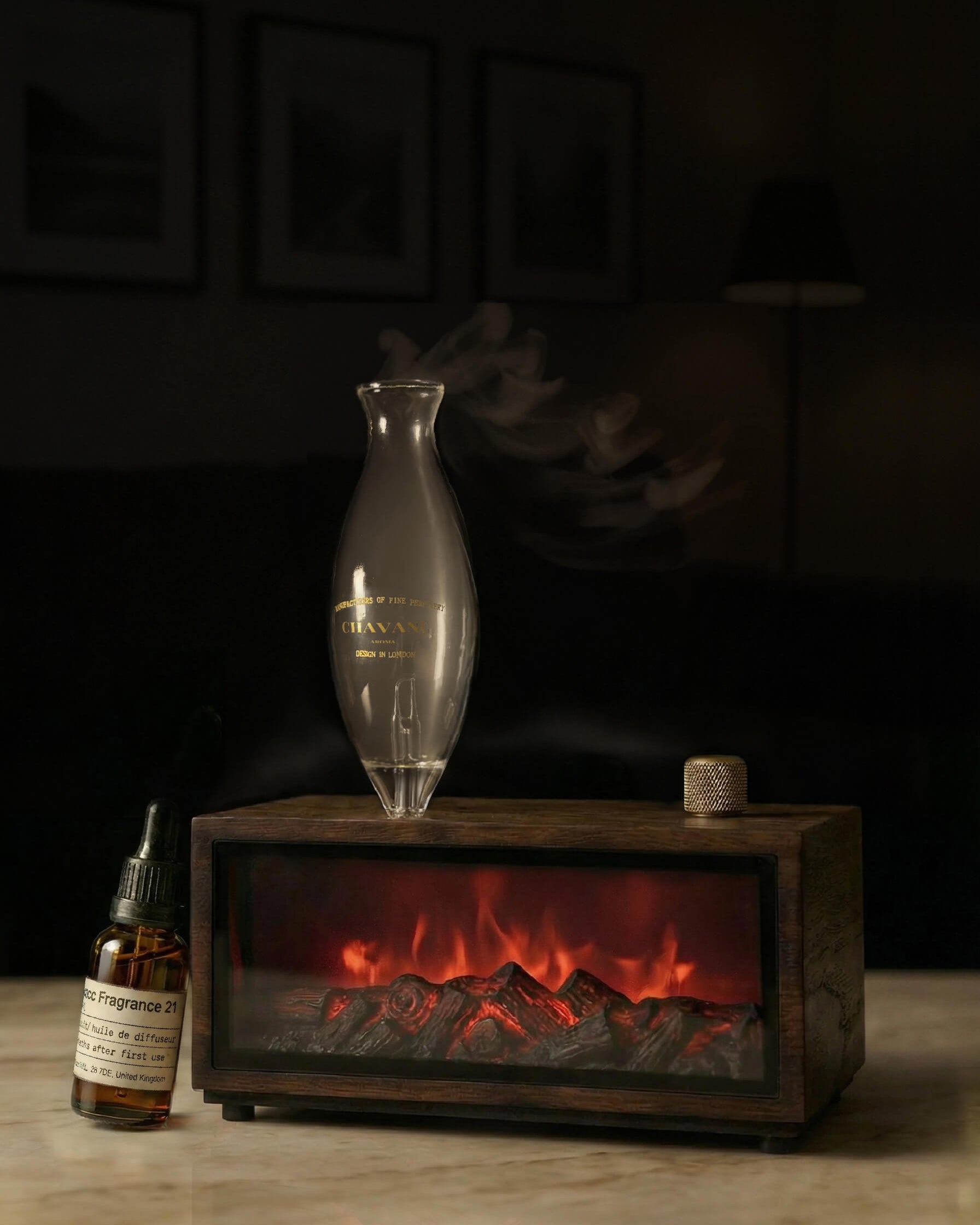 Chavanc-Aroma_Fragrance diffuser with wooden base and decorative bottles on a dark background