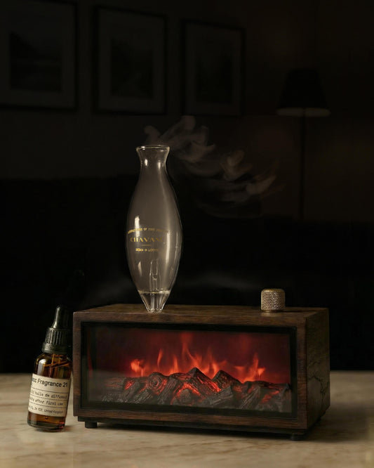 Chavanc-Aroma_Fragrance diffuser with wooden base and decorative bottles on a dark background