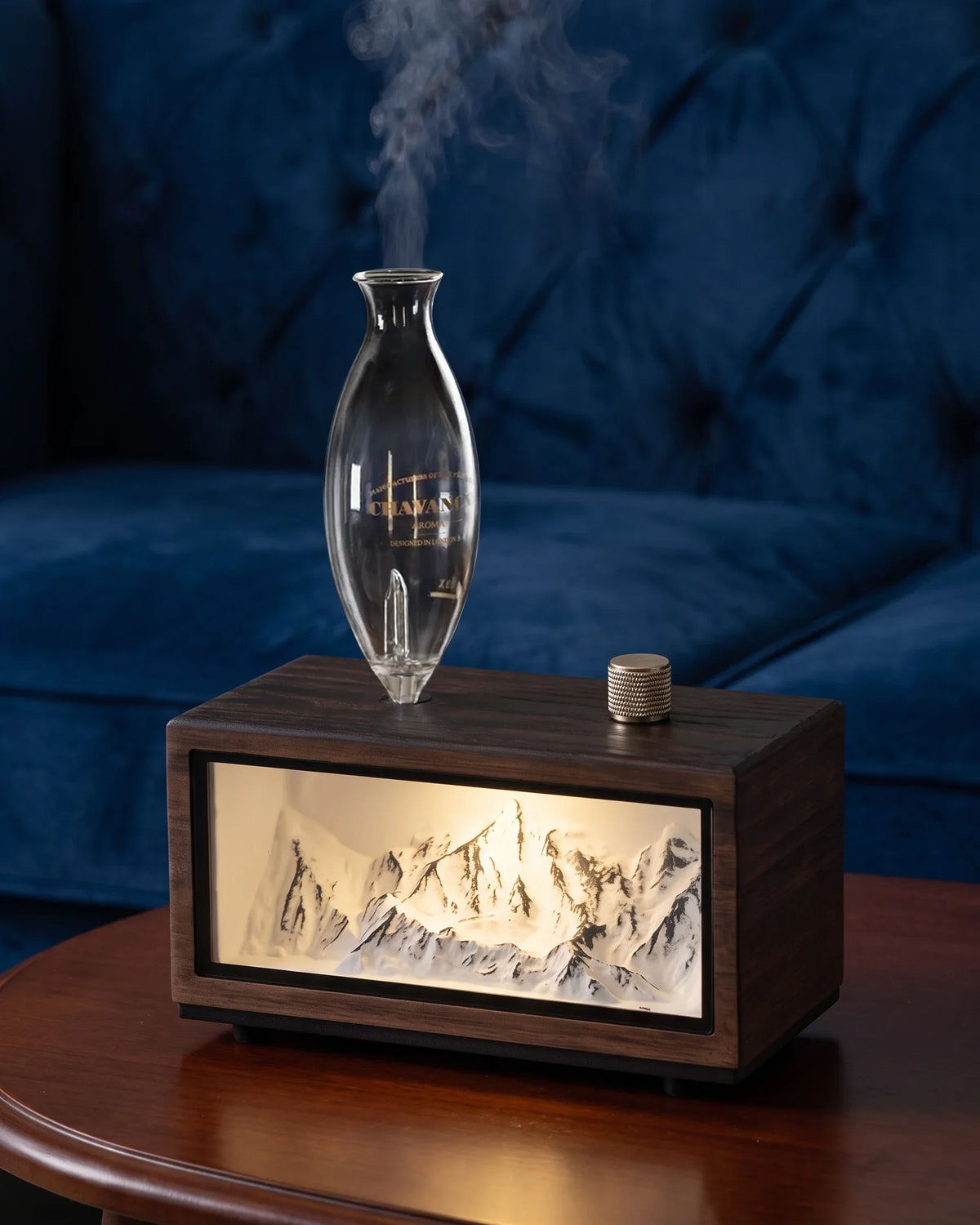 Chavanc Alpine waterless essential oil diffuser with illuminated snow mountain relief landscape in dark walnut wood base and hand-blown glass chamber