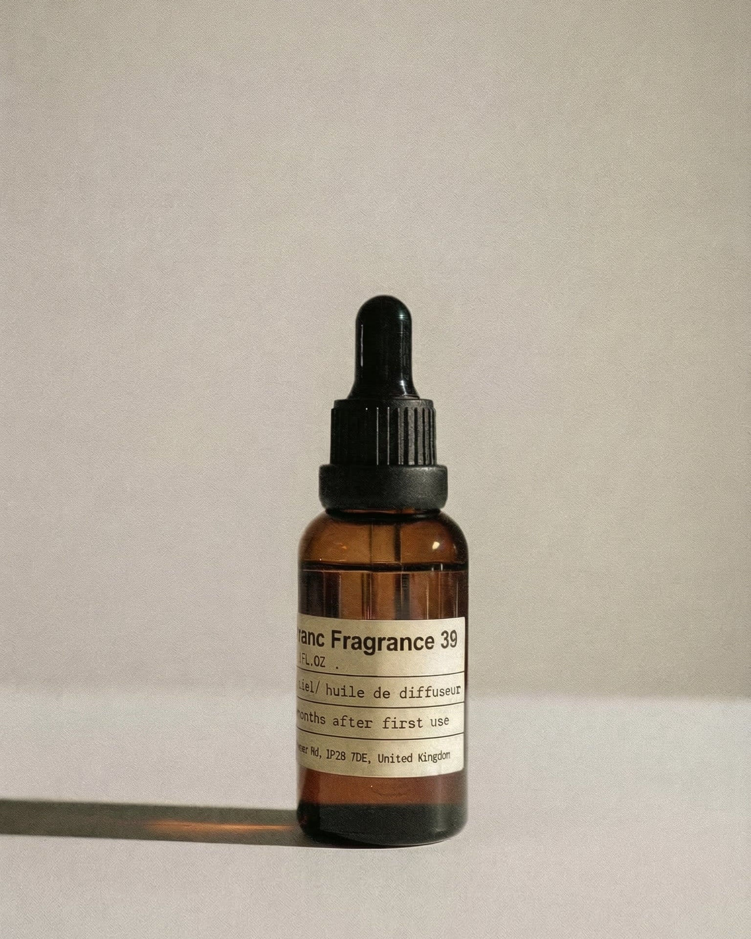 Chavanc_Aroma No. 39 The Capri Radiance essential oil in a vintage amber glass bottle with a minimalist label.