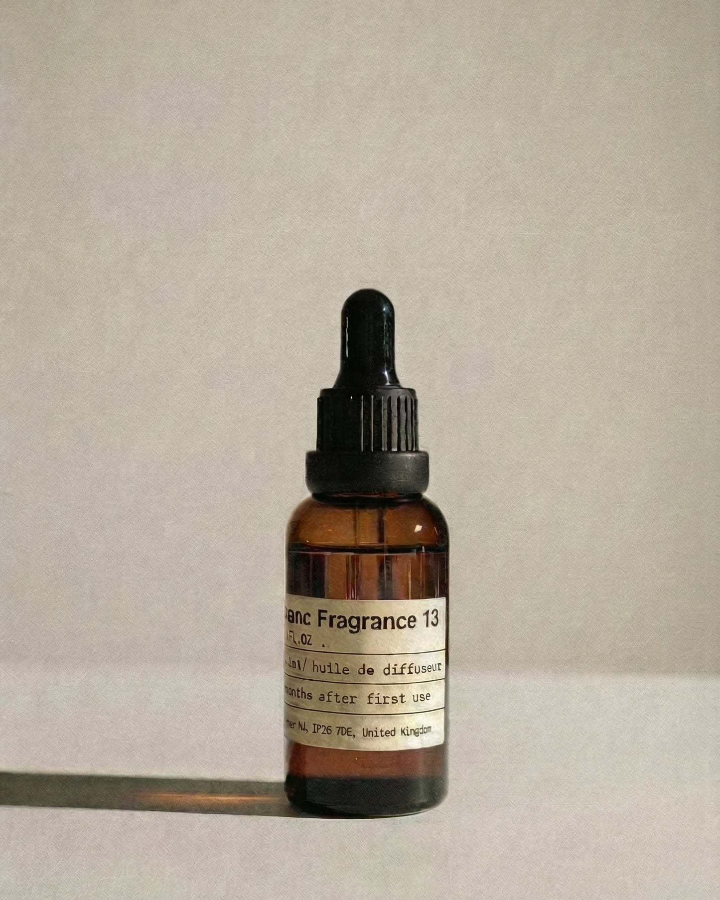 Chavanc Aroma_ No. 13 English Pear & Freesia Whisper essential oil in the iconic amber glass apothecary bottle.