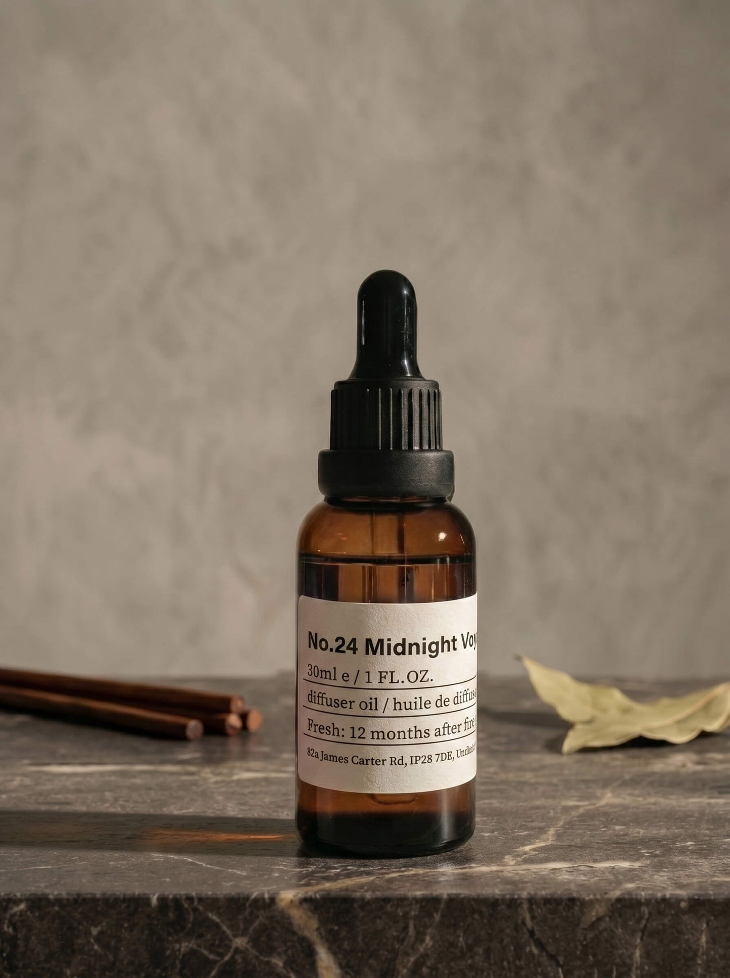 Chavanc_Aroma No. 24 Midnight Voyage essential oil in a vintage amber glass bottle, apothecary label design..
