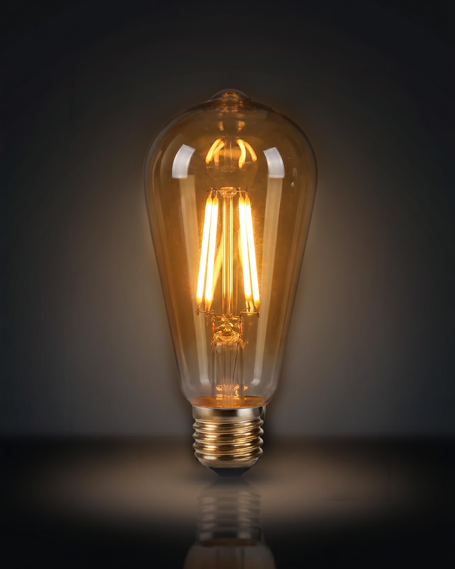 A classic ST64 clear glass LED replacement bulb for a Chavanc
aromatherapy diffuser, featuring four vertical warm-light filaments. The vintage Edison-style bulb is displayed on decorative, stacked cream ceramic plates with intricate scalloped edges, perfect for maintaining a timeless and elegant look for high-end home fragrance setups.