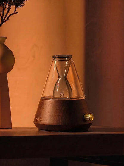 Chavanc waterless essential oil diffuser in vintage warm ambient room setting with solid ash wood base