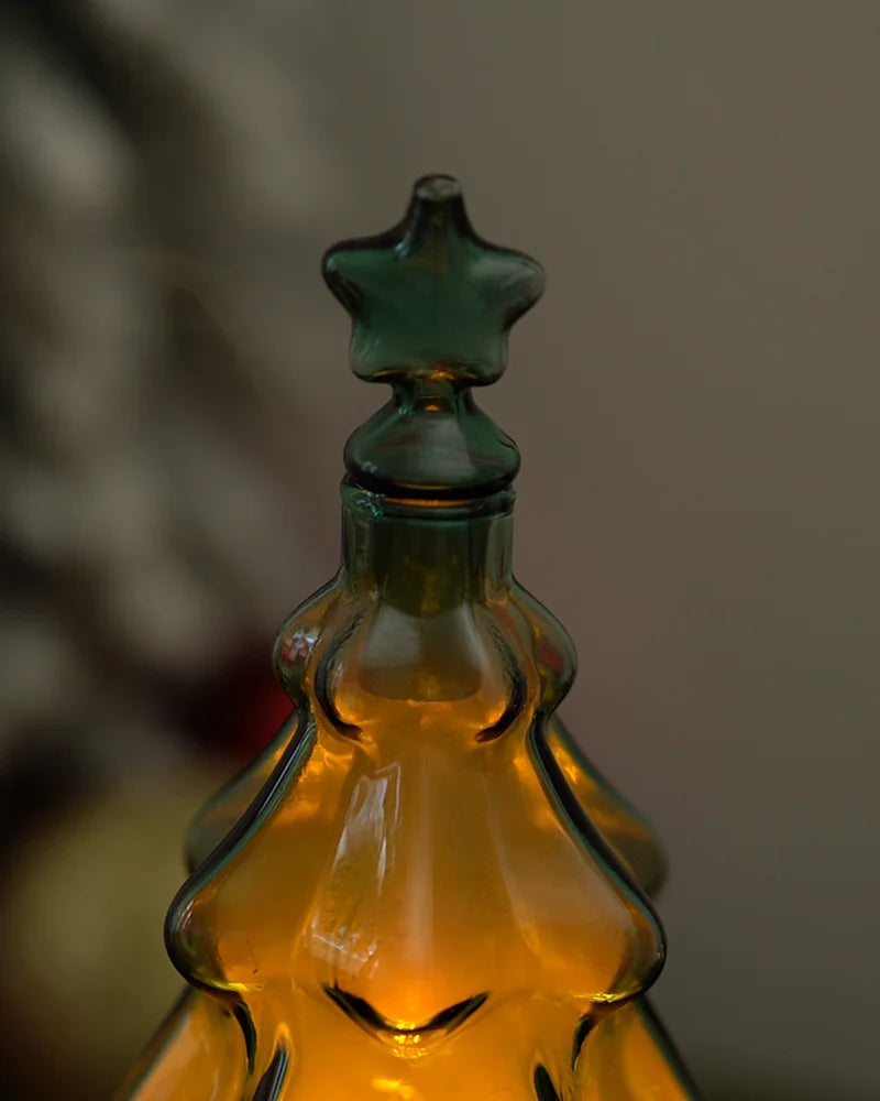 Close-up of artisan green crystal star directional mist cap on borosilicate Christmas tree essential oil reservoir