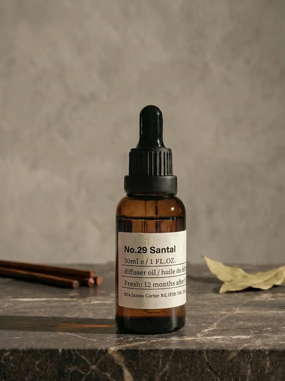 Vintage amber glass bottle of chavanc aroma 29 Santal Manuscript, featuring a minimalist apothecary label.